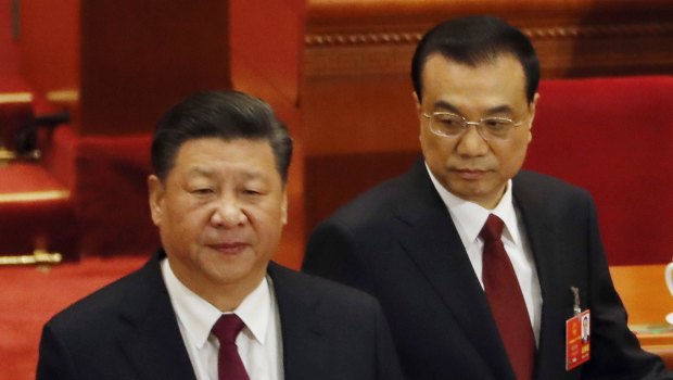 Chinese President Xi Jinping, left, and Chinese Premier Li Keqiang arrive for the opening session of the annual National People's Congress in Beijing.