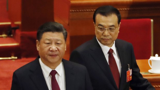 Chinese President Xi Jinping, left, and Chinese Premier Li Keqiang arrive for the opening session of the annual National People's Congress in Beijing.