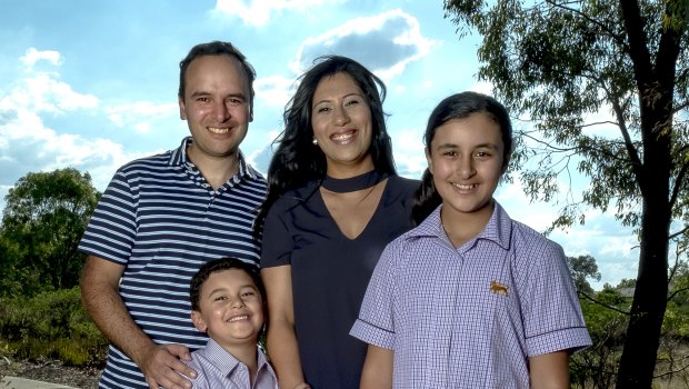 Ramy and Nermein Gouda with their children Marcus and Martina outside their home in Burnside Heights.