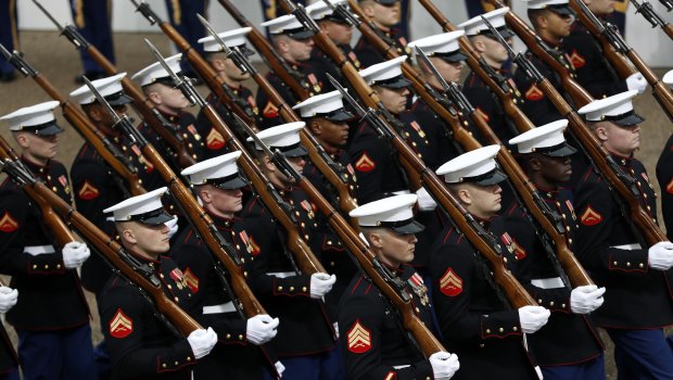 Military units march during the 58th Presidential Inauguration parade for President Donald Trump in Washington.