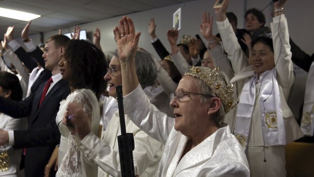Worshippers clutching AR-15 rifles participated in a commitment ceremony at the Pennsylvania-based church. 