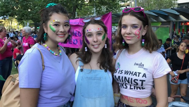 Maetenee Long, 19, Sunday Belford-Long, 16, and Faith O’Connor-Ludowyke, 16, at the International Women's Day rally in central Melbourne.
