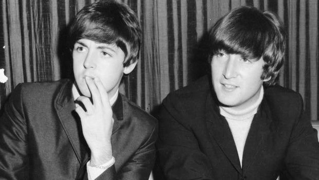 Paul McCartney and John Lennon at a Sydney press conference in June 1964.