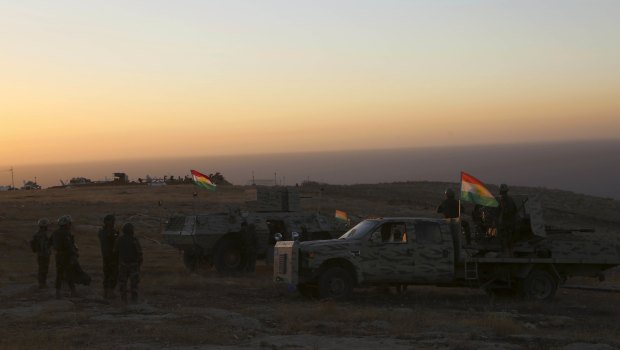 A peshmerga convoy drives towards a frontline in Khazer, about 30 kilometers east of Mosul.