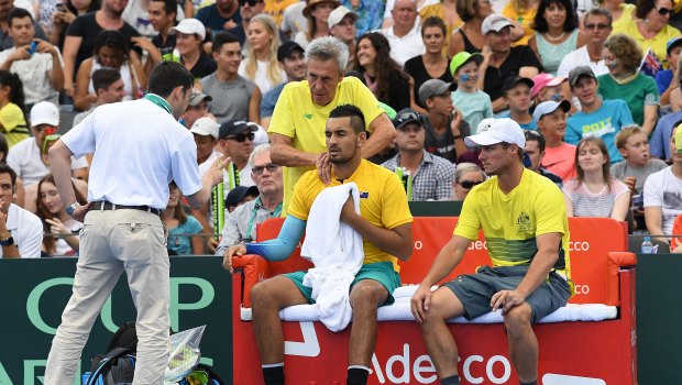 Nick Kyrgios receives treatment during a Davis Cup tie earlier this month.