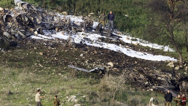 The Israeli military shot down an Iranian drone it said infiltrated the country early Saturday before launching a "large-scale attack" on at least a dozen Iranian and Syrian targets inside Syria, in its most significant engagement since the fighting in neighboring Syria began in 2011. 