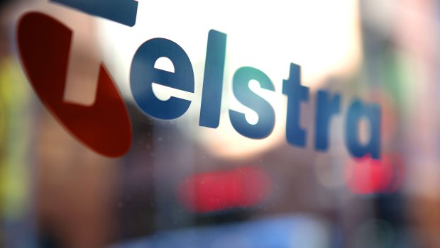 Telstra faces challenges with profits down and dividend slashed.