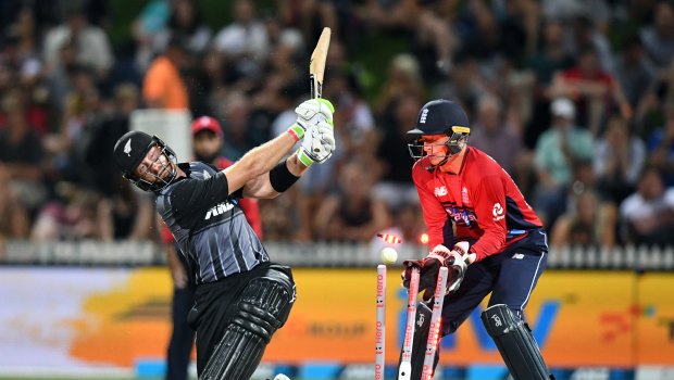 Heave ho: Martin Guptill is bowled for 62 by Dawid Malan in front of Jos Buttler at Seddon Park.