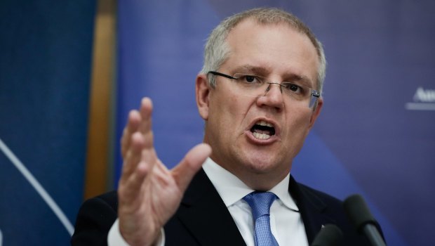 Treasurer Scott Morrison. In its mid-year budget update, the government revised down its expectations for wages growth.