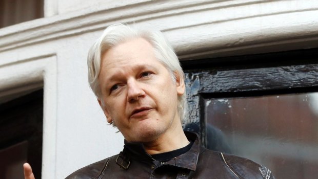 Julian Assange speaks to the media outside the Ecuadorian embassy in London.