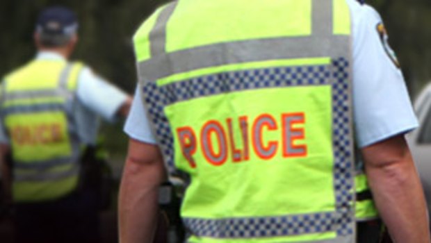 A police officer was left with a suspected broken nose after being hit in the face during a violent brawl involving up to 20 youths outside a shopping centre in Melton. 