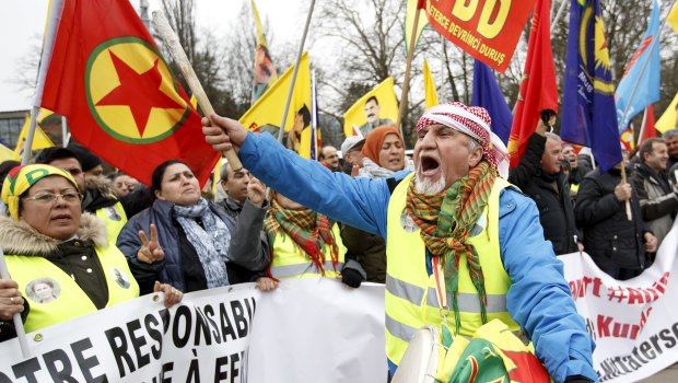 Pro-Kurdish demonstrators protest against Turkish military operations in Afrin, a city located in northern Syria, during a rally in front of the European headquarters of the United Nations in Geneva.