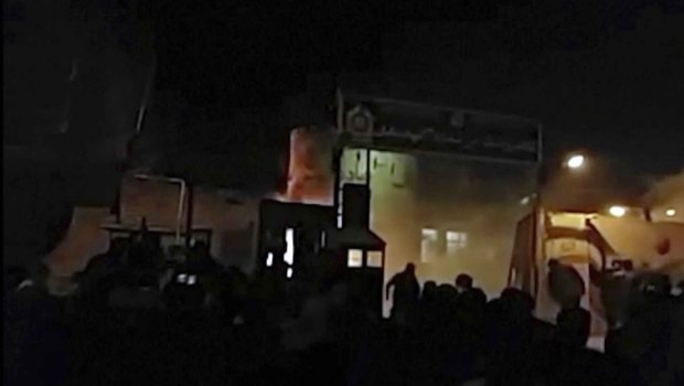 An image of attack on Iran police station in Qahdarijan, Iran, Tuesday, provided by an 'independent' news agency.
