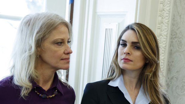 White House Communications Director Hope Hicks, right, stands with White House senior adviser Kellyanne Conway during a meeting in the Oval Office between President Donald Trump and Shane Bouvet, Friday, February 9, 2018.