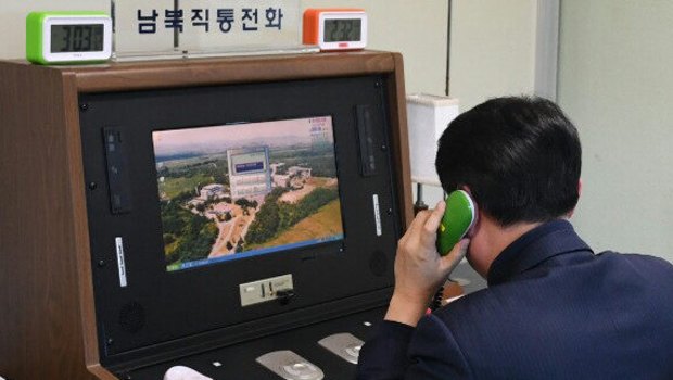 A South Korean official checks out a cross-border hotline with North Korea at the liaison office in the Joint Security Area, a small strip of land at the truce village of Panmunjom, on Jan. 3, 2018. North Korea said the same day that it will reopen the suspended inter-Korean communication line at the shared border village of Panmunjom at 3:00 p.m. 