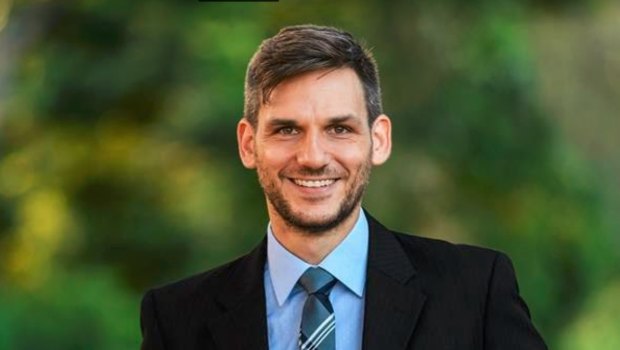 Greens candidate for Maiwar Michael Berkman has claimed victory in the Queensland Parliament.