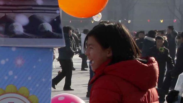 North Koreans play on Kim Il-sung Square on New Year's Day.