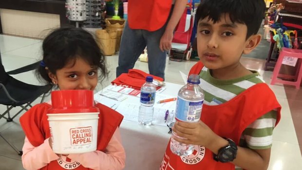 Children from the  Ahmadiyya Muslim community raising funds for the Red Cross in 2017. 