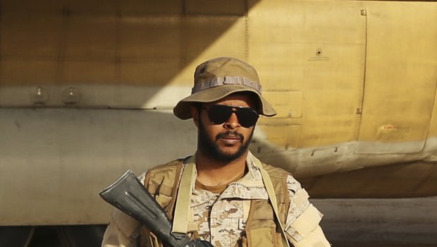 A Saudi soldier guards an aid flight at an air base in Marib, Yemen earlier this month.