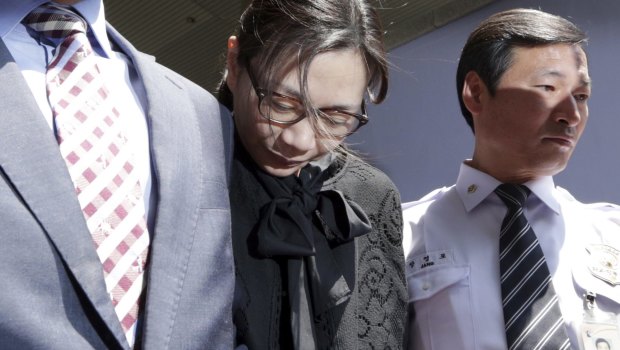 Former Korean Air executive Cho Hyun-ah, centre, leaves the Seoul High Court in 2015. The upper court sentenced Cho to 10 months in prison and then suspended the sentence for two years. 