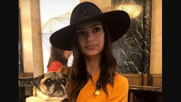 Emily Ratajkowski poses with her pug on her wedding day.