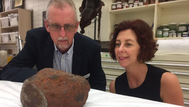 Queensland Museum's acting chief executive Dr Robert Adland with Queensland's Assistant Minister of State Jennifer Howard with the rare iron-nickel Georgetown meteorite.