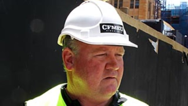 Former CFMEU state secretary Brian Parker wearing a sticker banned under the Commonwealth building code 