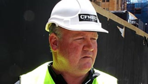 Former CFMEU state secretary Brian Parker wearing a sticker banned under the Commonwealth building code 