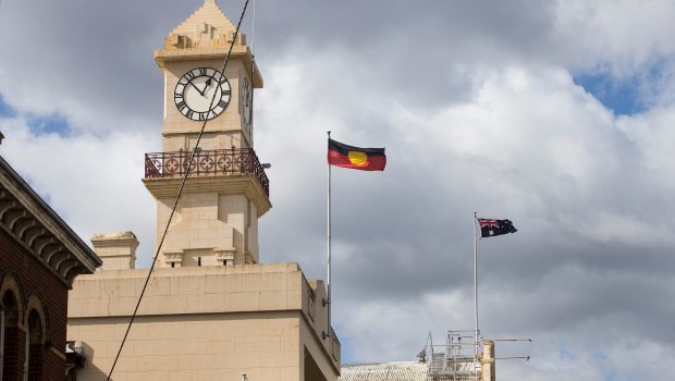 Flags flying over Richmond Town Hall, where Yarra Council took its vote in August. 