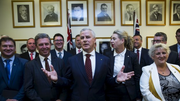 The new leader of the National Party, Michael McCormack, flanked by Nationals MPs following a leadership ballot on Monday.