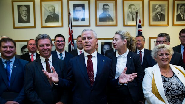 The new leader of the National Party, Michael McCormack, flanked by Nationals MPs following a leadership ballot on Monday.