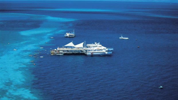 The helicopter crashed near a tourist pontoon at Hardy Reef in the Whitsundays.