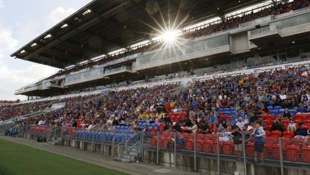 A-League fans watch the match between Newcastle Jets and Melbourne Victory in Newcastle.