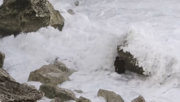 Veteran Australian big wave surfer Ross Clarke-Jones scrambled up a cliff after a wipeout washed him over rocks. 
