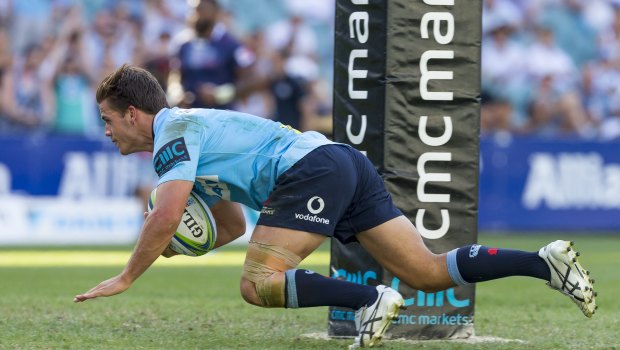 Deluge: Mitchell Short of the Waratahs scores during the home side's second-half rally.