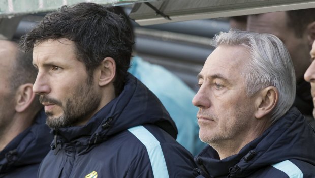 Watching on: A disappointing debut for van Marwijk (right) in his first appearance as Socceroos manager.