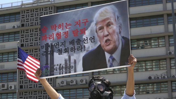 A South Korean environmental activist protests against the US withdrawal from the Paris climate accord last year.