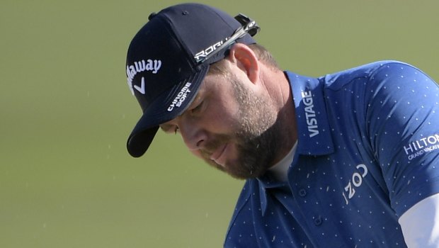 Down and out: Marc Leishman.