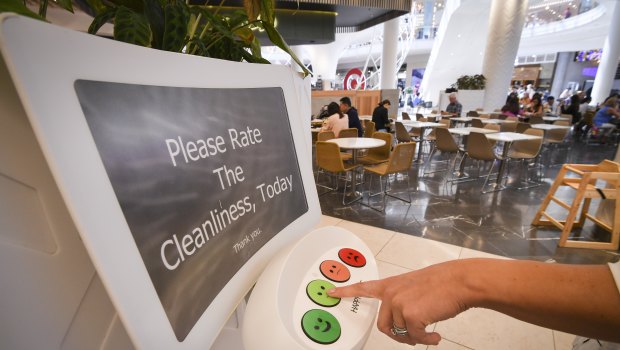 A customer registers their feedback via a HappyOrNot terminal in the Chadstone Shopping Centre food court.