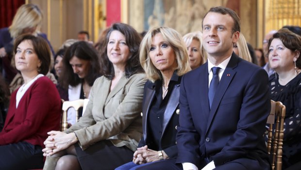 French President Emmanuel Macron, right, and his wife Brigitte Macron, second right, listen to the French Minister for Gender Equality last year.