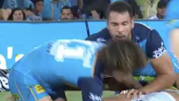 Warning: Kevin Proctor appears to execute a 'squirrel grip' on the Raiders' Jordan Rapana.