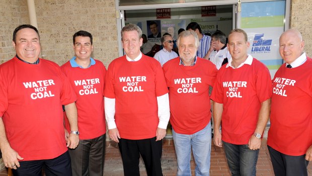 Premier Barry O'Farrell in 2011 with (from left) Chris Holstein (Member for Gosford), Darren Webber (Member for Wyong), Barry O'Farrell (Premier), Alan Hayes (Australian Coal Alliance), Chris Spence (Member for The Entrance) &amp; Chris Hartcher (Member for Terrigal &amp; Minister for Energy) wearing shirts protesting the mine. His government later approved the project.