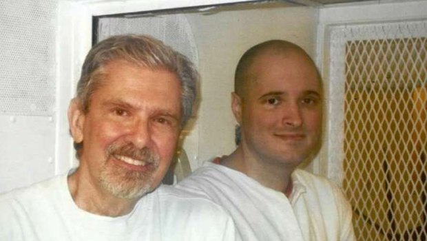 Thomas 'Bart' Whitaker, pictured with his father Kent Whitaker (left) during a 2016 prison visit, was spared the death penalty.