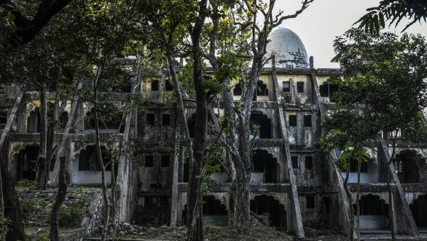 An abandoned building at the ashram formerly run by Maharishi Mahesh Yogi has been  swallowed by the forest.