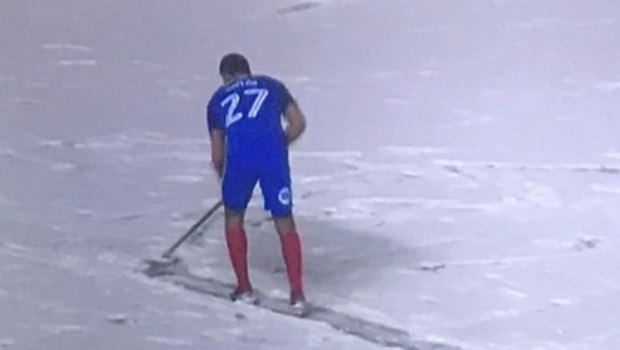 Getting to work: Steven Taylor cleans up snow.