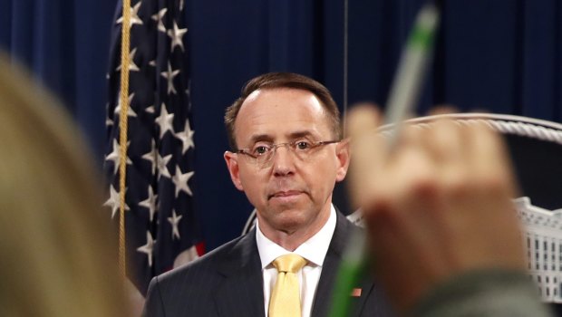A reporter asks a question of  Deputy Attorney General Rod Rosenstein, after he announced that the office of special counsel Robert Mueller says a grand jury has charged 13 Russian nationals and several Russian entities.