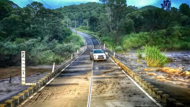 A car still stranded on a Gold Coast road on Tuesday morning.