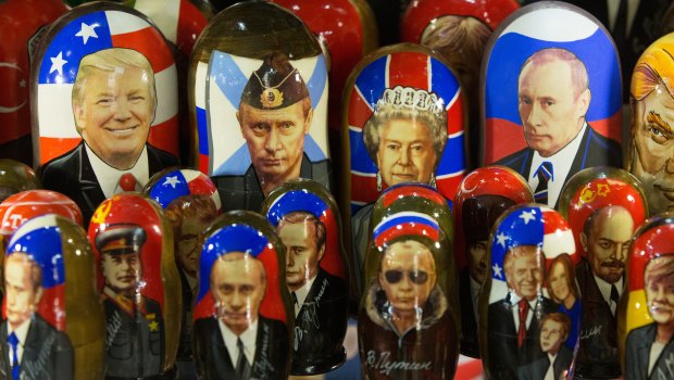 A gift shop displays souvenir matryoshka dolls decorated with the faces of Vladimir Putin, Donald Trump and Queen Elizabeth.