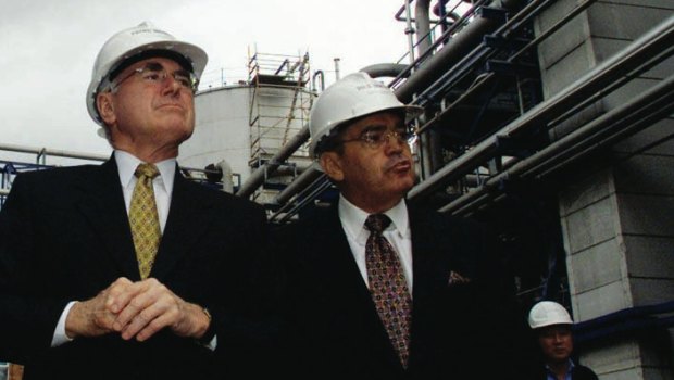 Manildra's Dick Honan (right) showing then prime minister John Howard around the company's ethanol plant in Bomaderry.