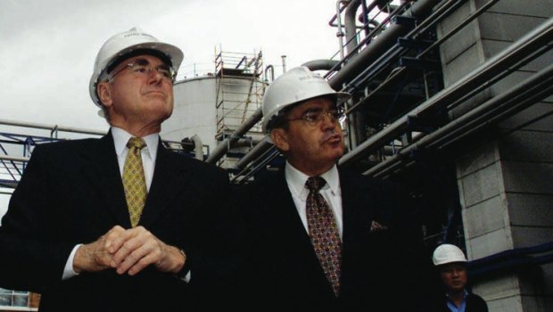 Manildra's Dick Honan (right) showing then prime minister John Howard around the company's ethanol plant in Bomaderry.